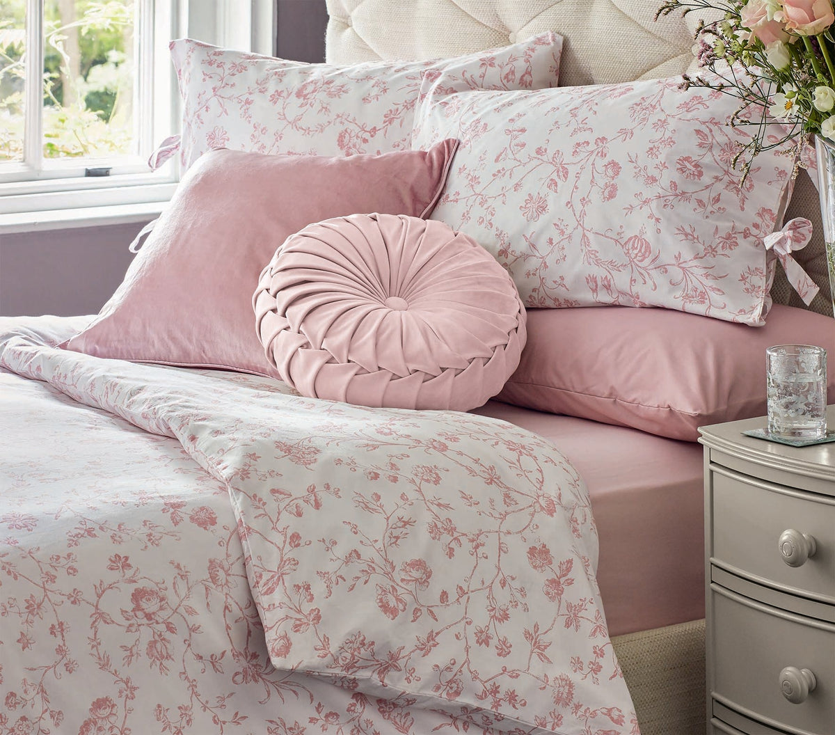 The Laura Ashley aria duvet set in a pretty pink floral design also showing the nigella Rosalind pink cushions
