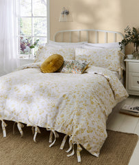The Aria ochre spring time floral yellow design bedding by Lauras Ashley