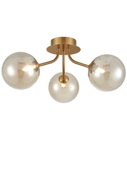 Cosmic 3 light fitting in antique gold with amber glass