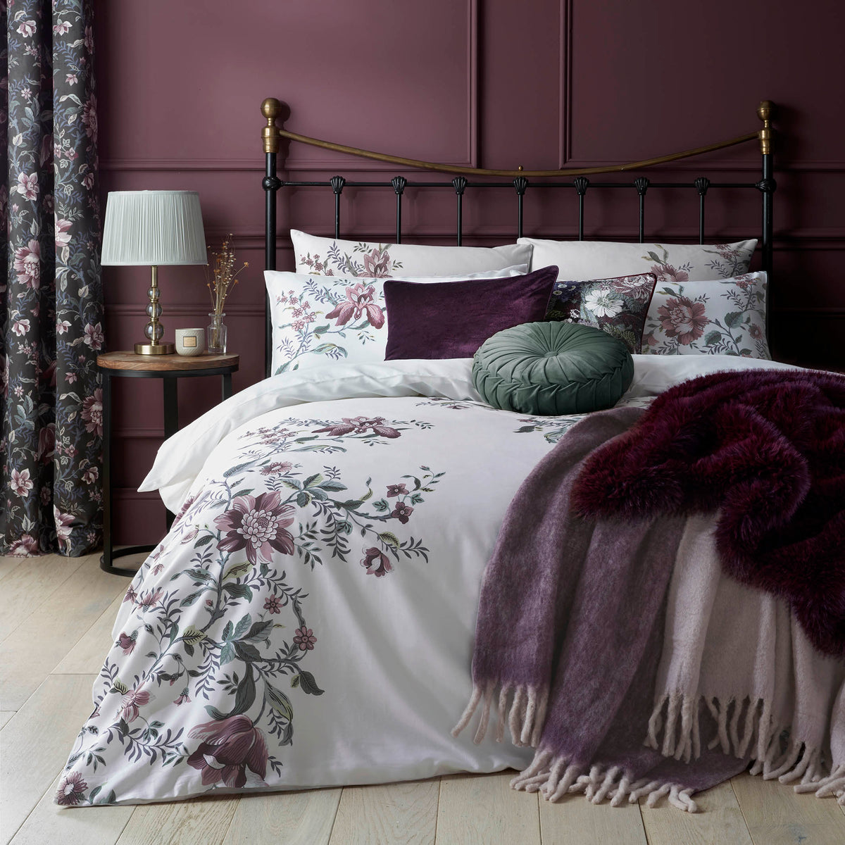 Editas Garden duvet set by Laura Ashley in a floral purple and blackberry design, with a white background its great for an all year round look