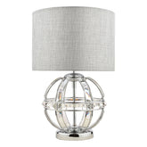 The Aidan table lamp from Laura Ashley is 32 cm in diam and comes with a pale grey linen straight drum shade, the fabric appears to be a rough texture, the base itself is an open globe constructed with a polished chrome frame that houses sections of curved glass that create the globe. It then sits on a solid round metal base also finished in polished chrome. The bulb is housed in the shade section as per most lamps and it is switched with a push button through on the main lamp holder.