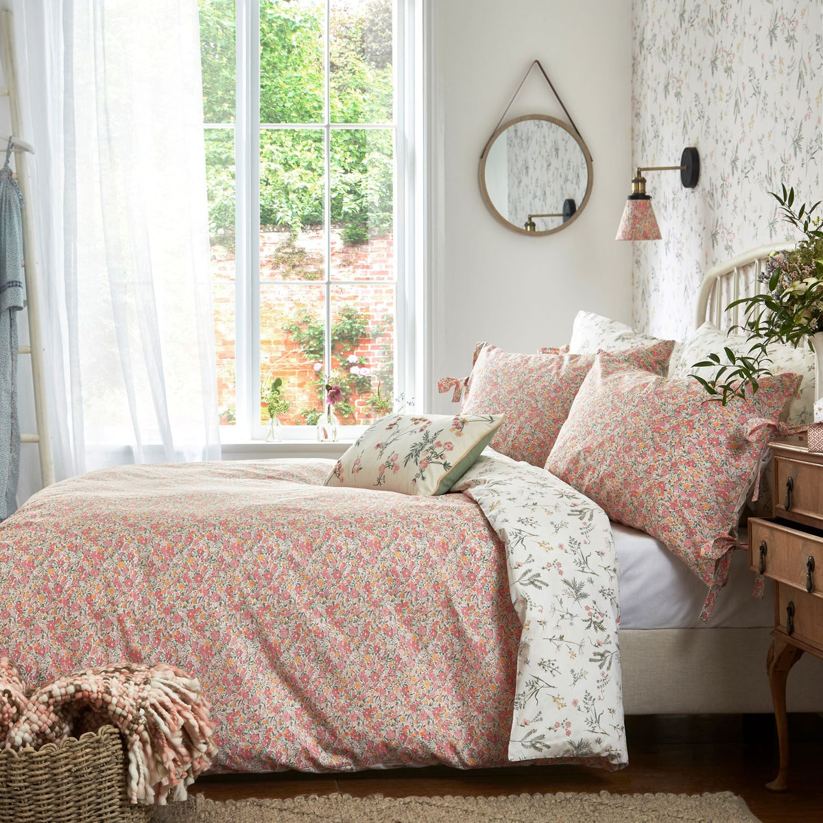 The Laura Ashley Lodestone Coral duvet set luxuriously soft and 100% cotton floral design with soft pink colours