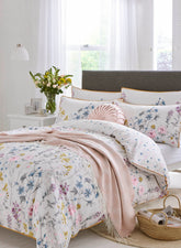 Detailing the Rosanna blush cushion the Wild meadow design beding by Laura Ashley