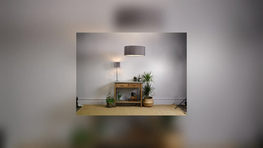 Welcoming hallway lit by a pendant lantern with wall lights along the wall