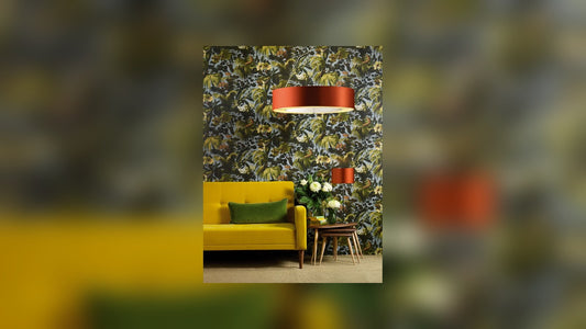 Table lamp with a linen drum shade glowing warmly on a console table