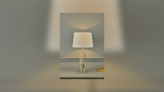 Pair of table lamps with fabric shades lighting a living room sideboard