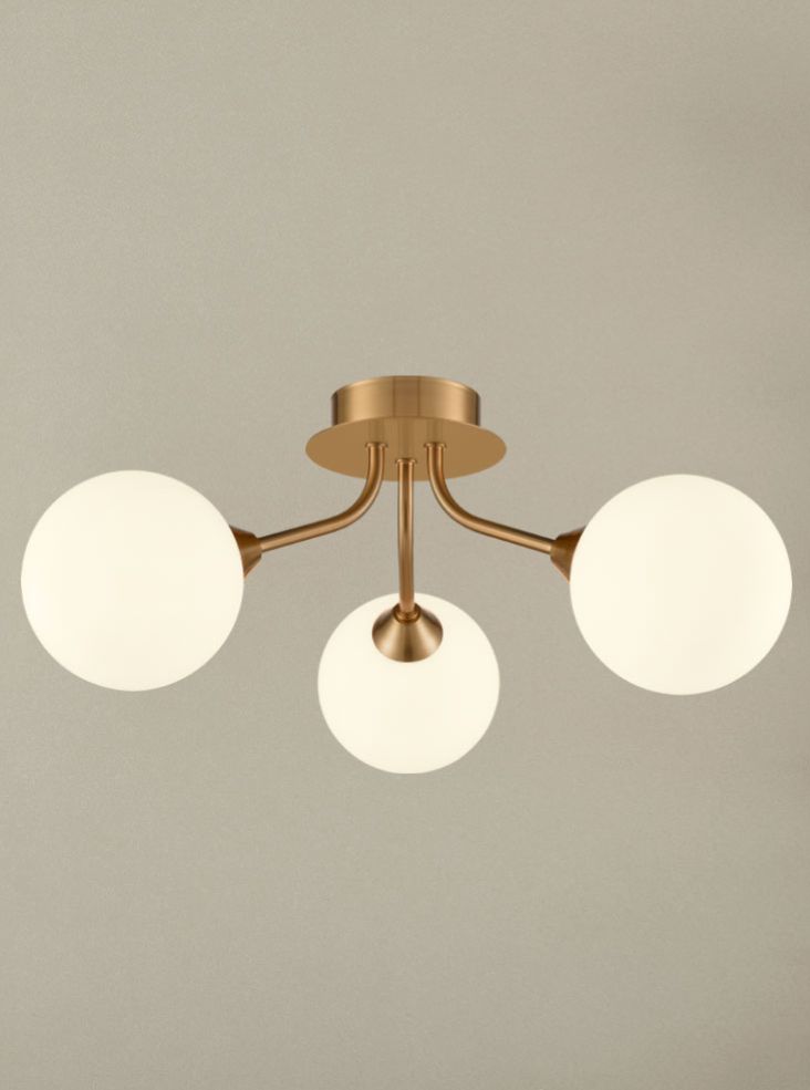 Cosmic 3 light fitting in antique gold with matt opal glass