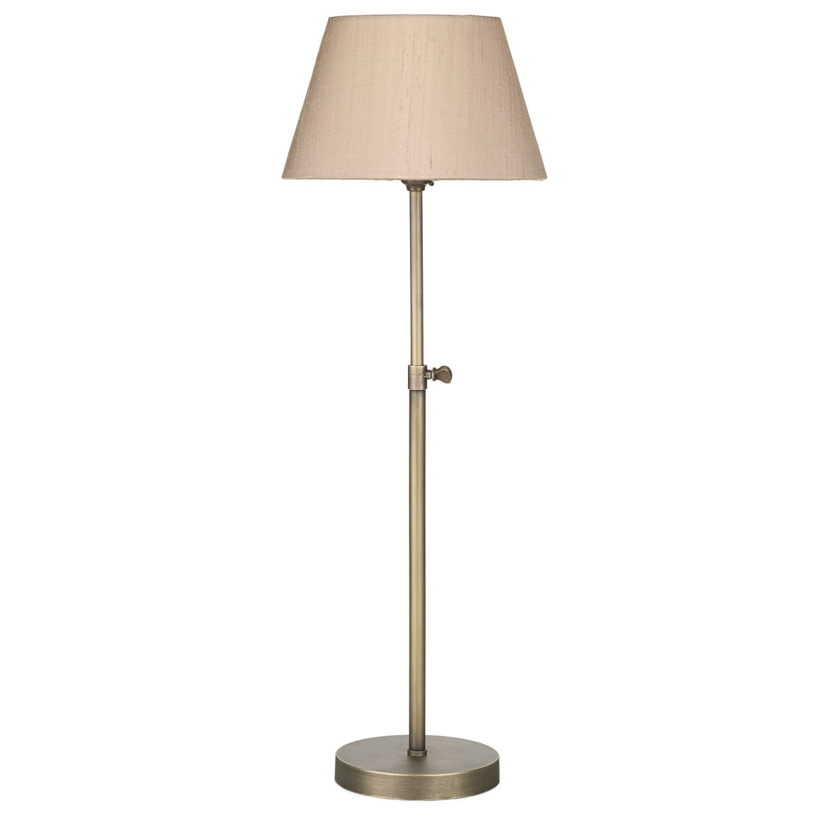 The hicks table lamp base is a single simple stem lamp finished in antique brass with a single gas button decorative feature on the side, the lamp base is smooth and flat and circular, designed on the old retro gas lamps its a simple timeless design, we show it here with a neutral taupe shade that is tapered from the top to bottom of the shade, it is 20cm diam at the bottom of the shade and is not included in the price of the lamp but it can be ordered additionally with a huge choice of colours available.