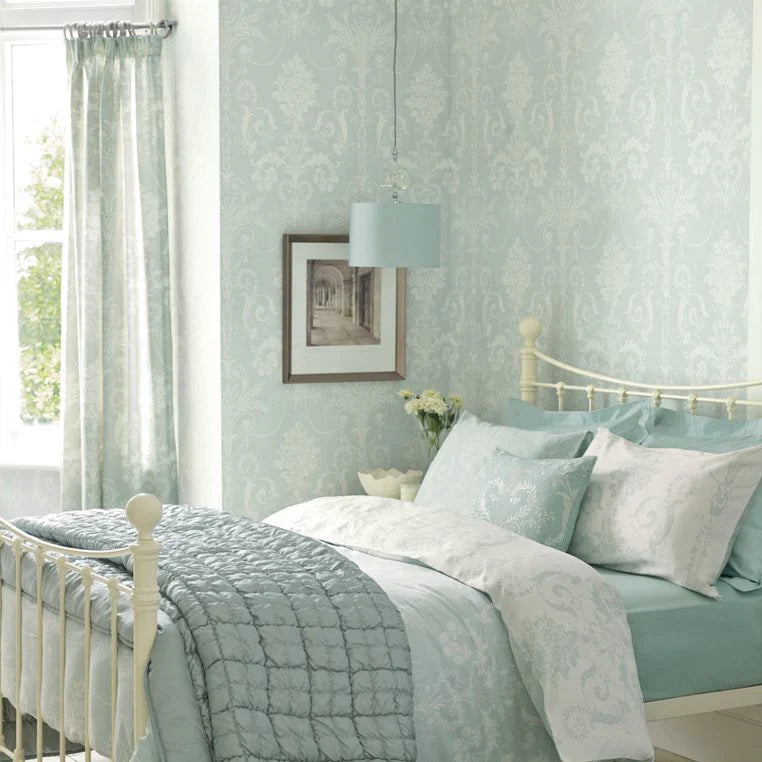 Installing Laura Ashley wallpaper for a feature wall in the living room