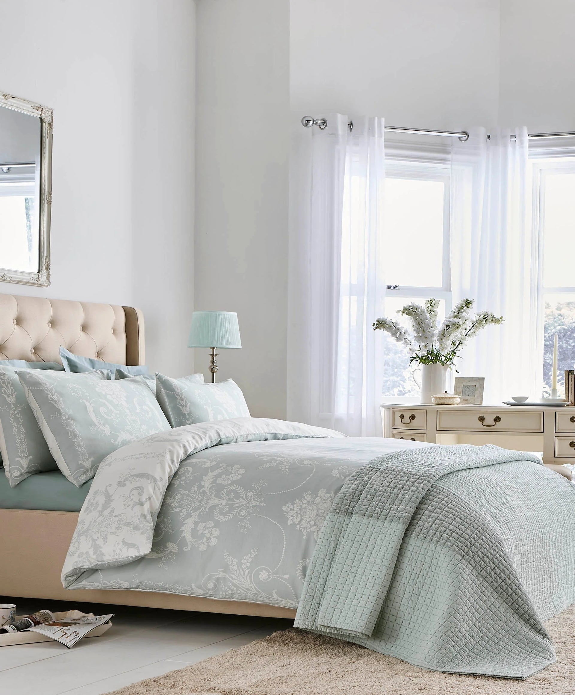 Luxurious Laura Ashley paisley cotton bedding on a king-size bed
