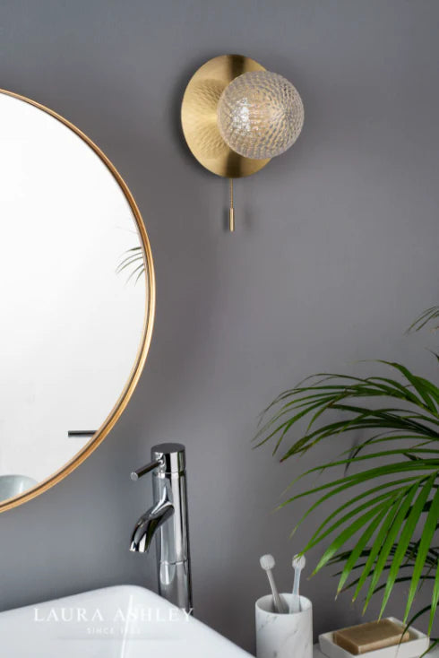 Modern LED bathroom vanity light fixture above mirror