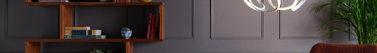 Double insulated Alonsa white LED pendant lighting a grey panelled living room with walnut shelving