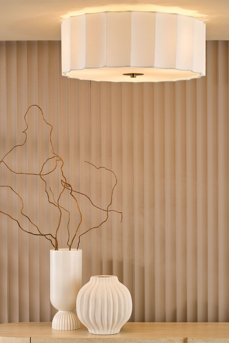 Double insulated Noura ivory and white flush ceiling light fitted to a low ceiling in a neutral living room